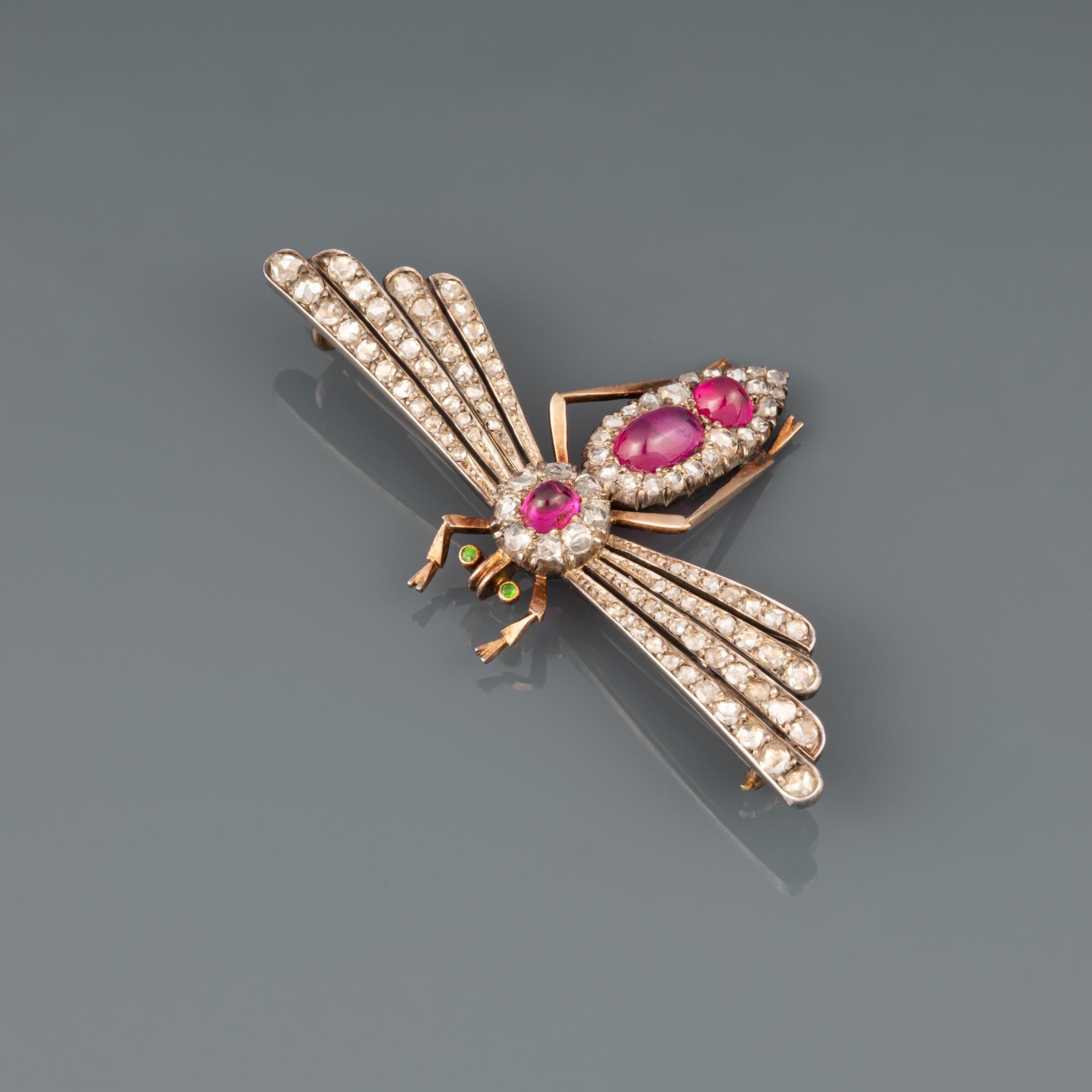 A very beautiful antique brooch, made in France circa 1870.

Made in rose gold 18k and silver. Hallmarks for gold: the eagle head.

The Rubys are natural, probably from Burma. Set with Rose curt diamonds.

Dimensions: 62 mm width, 38 mm
