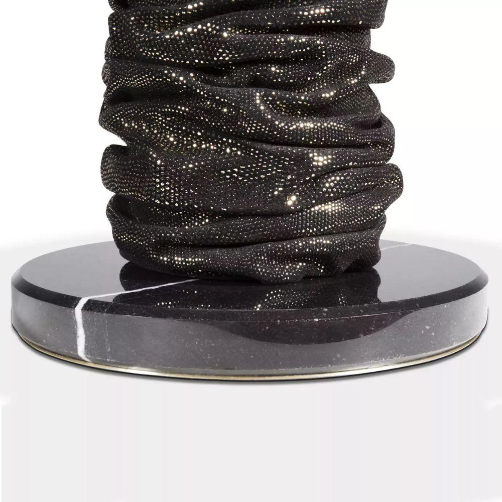 The curvaceous Ruche lamp is a flash back to the 80's slouch sleeve and boot. Its gathered leather-like shape glistens under its light.

Materials & Finishes As Shown: 
Base: Nero Marquina Marble
Body: Pixel Leather from the KOKET Textiles