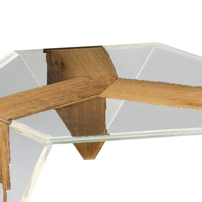 This exquisite piece is part of Ruche series of hexagonal coffee tables and it can stand alone or it can be combined with other tables from the same series. Its striking appearance is made of two layers of glass containing three sections of