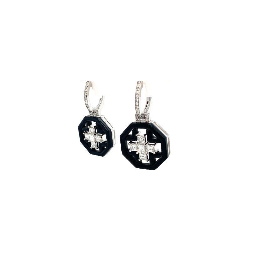 With 7.97 carats of black agate and 1.82 carats of carré-cut diamonds set in a cross design, these 18k white gold hexagonal dangle earrings are a unique statement piece.

18K White Gold
Diamond Carré - 1.82 cts
Black Agate Hexagon- 7.97 cts

All