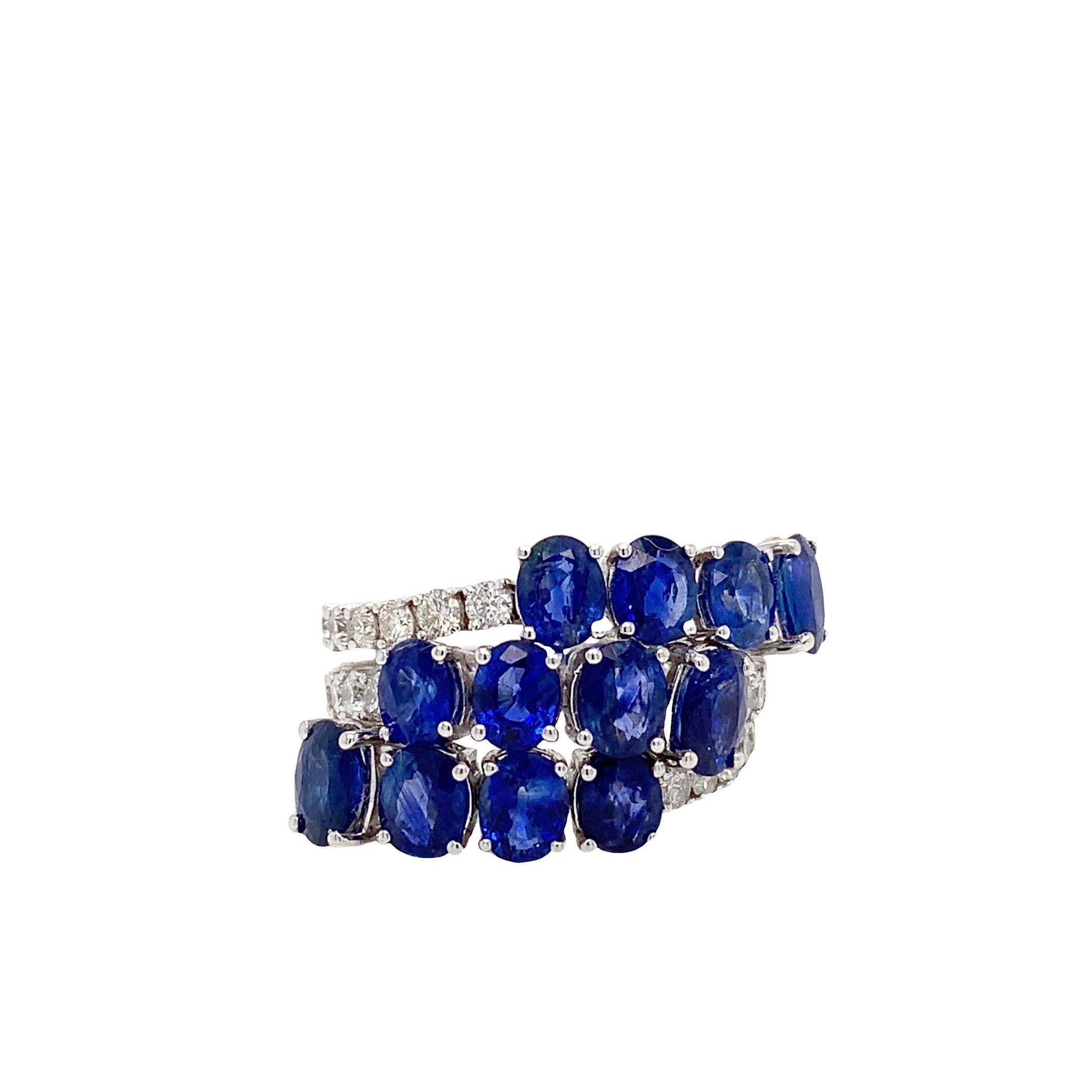18K White Gold
Blue oval sapphires: 5.89ct total weight.
Diamonds: 1.51ct total weight.
All diamonds are G-H/SI stones.
Width of the ring -  is approximately 1.7cm/0.66inches.
