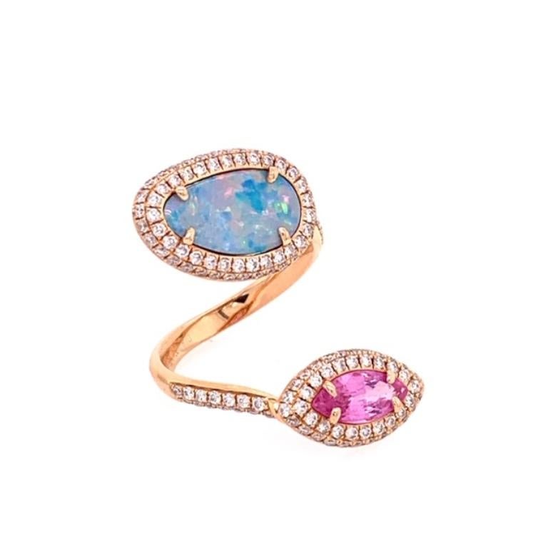 Ocean Bliss Collection

Capture the essence of spring with this pastel hued Australian Opal and Pink Sapphire bypass cocktail ring with diamond accents set in 18 karat rose gold. 

Australian Opal: 1.22ct total weight.
Pink Sapphire: 1.01ct total