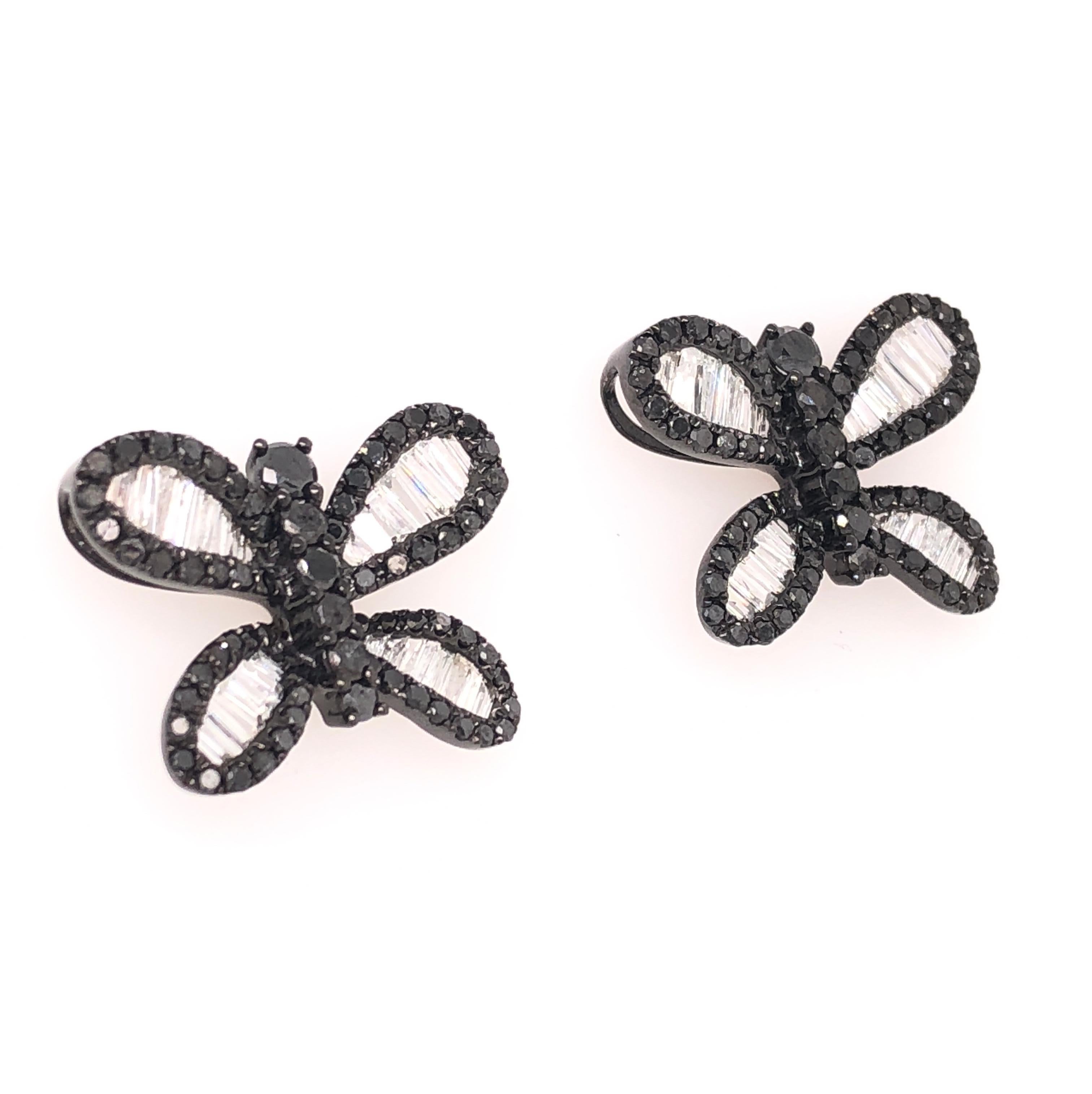 Organic Forms Collection 

Butterfly shaped black and white Diamond studs set in 18K black rhodium gold. 

Black Diamond: 1.22ct total weight.
Diamonds: 0.70ct total weight.
All diamonds are G-H/SI stones.
Width of butterfly -  is approximately