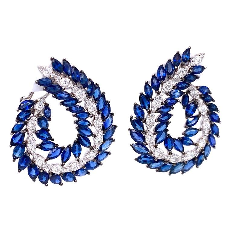 Skylight Collection 

C shape Earrings featuring marquise blue Sapphire and round brilliant cut white Diamonds. Set in 18K white gold. 

Blue Sapphire: 10.20ct total weight. 
Diamonds:1.30ct total weight.
All diamonds are G-H/SI stones.
