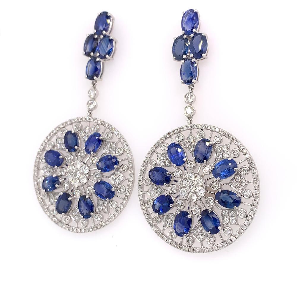 Midnight Blue Collection

Oval blue Sapphire and round Diamond chandelier earrings set in 18K white gold. 

Blue Sapphire: 14.12ct total weight.
Diamonds: 2.52ct total weight.
All diamonds are G-H/SI stones.