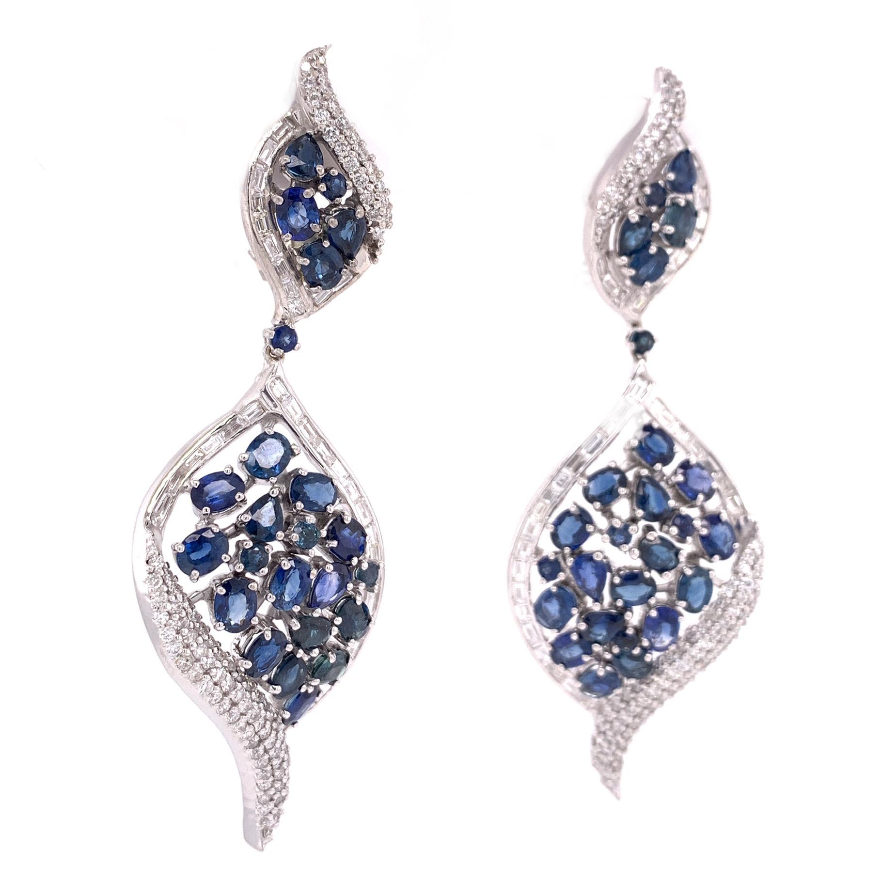 Midnight Blue Collection

Multi shape Blue Sapphire and Diamond baguette and pavé chandelier earrings set in 18K white gold.

Blue Sapphire: 8.54ct total weight.
Diamonds: 2.47ct total weight.
All diamonds are G-H/SI stones.