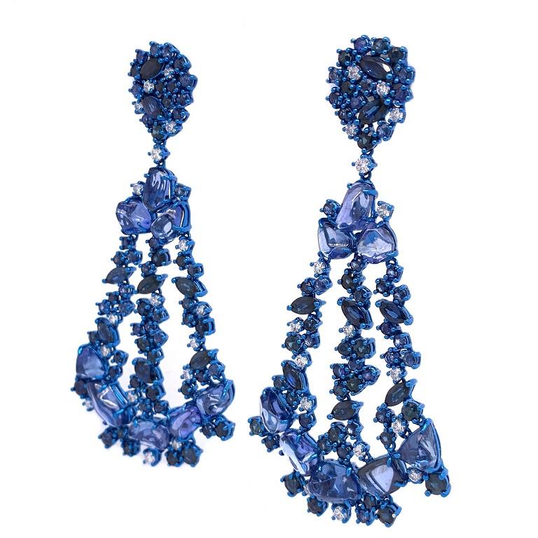 18K Blue Rhodium Gold.
Blue Sapphires: 35.91ct total weight. 
Diamonds: 1.34ct total weight. 
All diamonds are G-H/SI stones.