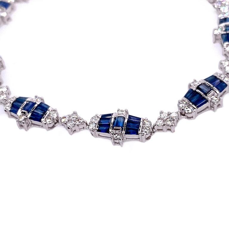 18K White Gold
Blue Sapphire: 4.90ct total weight. 
Diamonds: 1.82ct total weight. 
All diamonds are G-H/SI stones.
