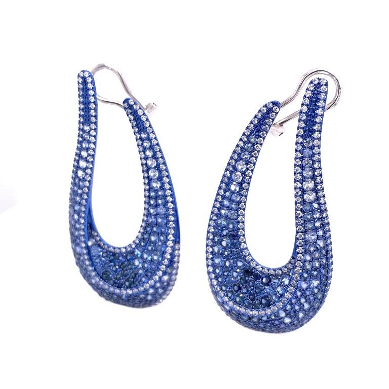Aurora Collection 

Ombre blue Sapphire and Diamond swoop style earrings set in 18K blue rhodium gold. 

Blue Sapphire: 6.45ct total weight.
Diamonds: 1.85ct total weight.
All diamonds are G-H/SI stones.

