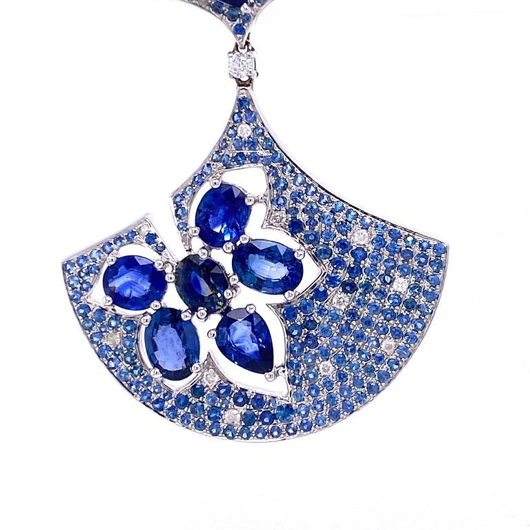 18K white gold. 
Blue Sapphires: 17.80ct total weight. 
Diamonds: 0.42ct total weight.
All diamonds are G-H/SI stones.
