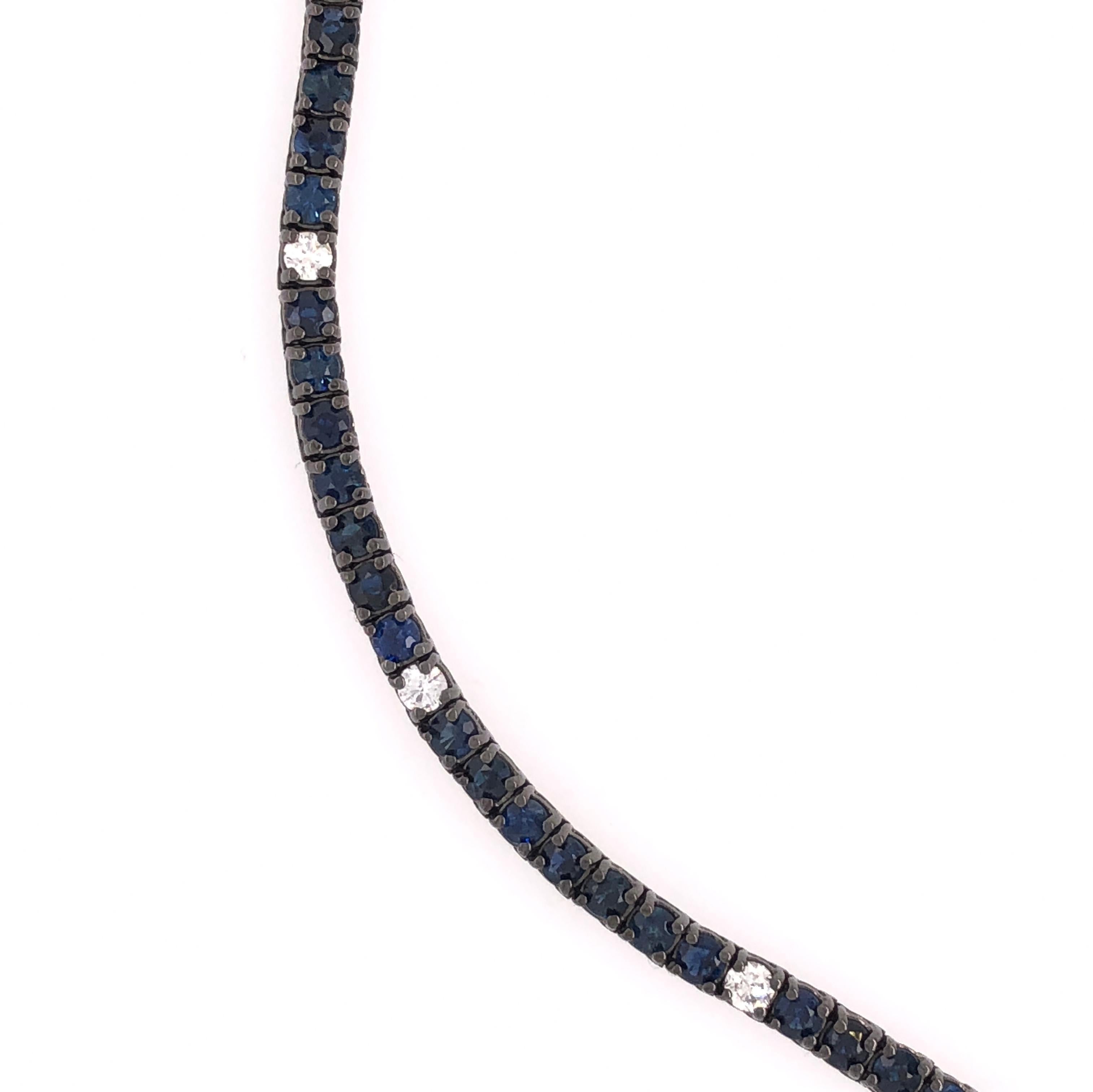 18K Tinted Black Rhodium
Blue Sapphire: 5.06ct total weight.
Diamonds: 0.51ct total weight.
All diamonds are G-H/SI stones.
Width - is approximately 0.3cm/0.12inches.
Length - is approximately 18cm/7.09inches.