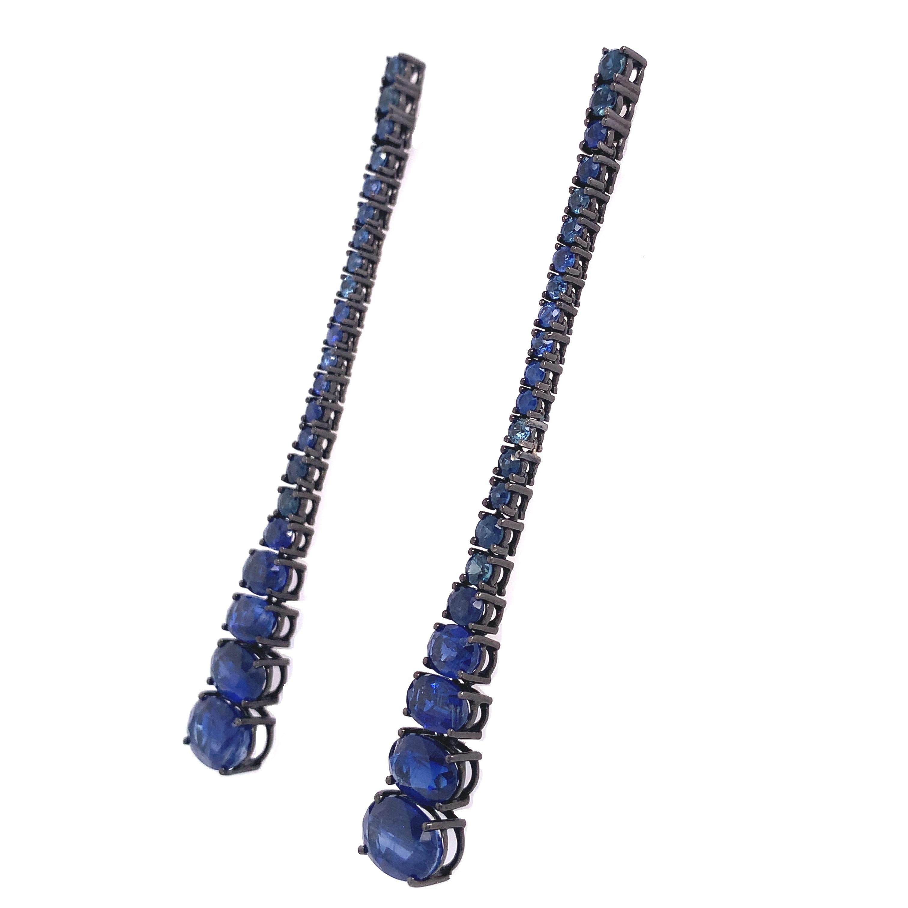 Exclusive Collection,

Blue Sapphires totaling 2.1 carats combined with Kyanite totaling 8.34 carats captivate with their radiance and chromatic intensity in these magnificent linear earrings
