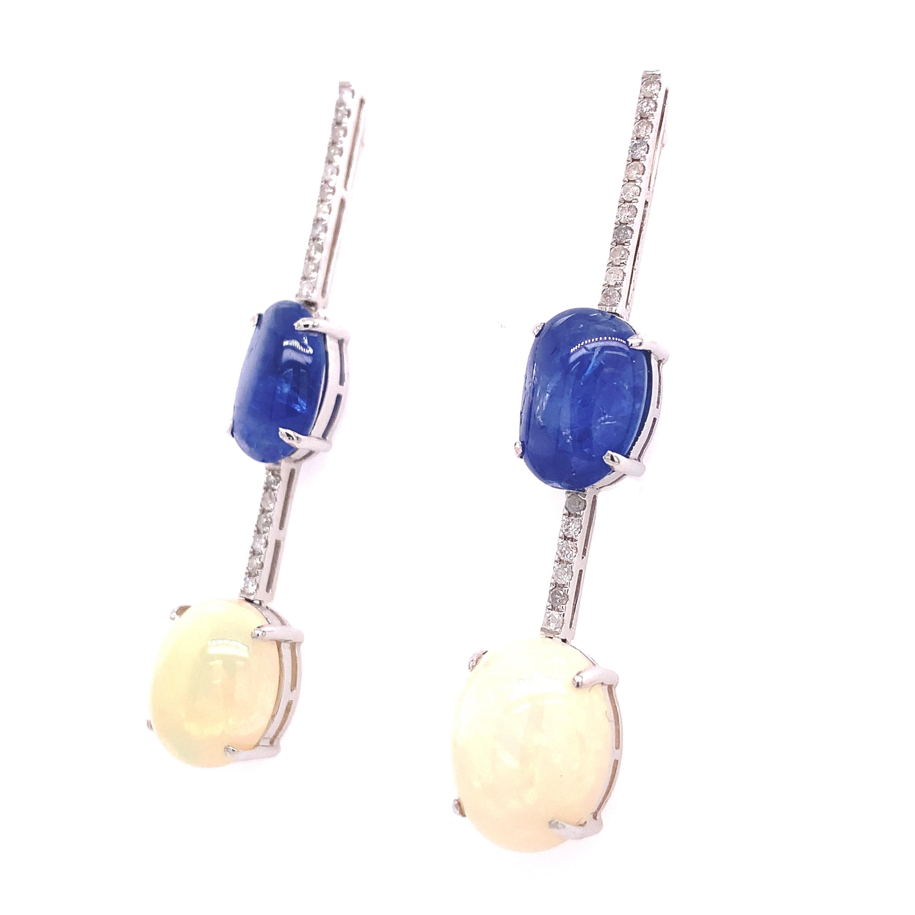 With a 9.75 carat Blue Sapphire and 7.73 carat Opal beating at the heart, these exquisite linear earrings extend into a sparkling row of diamonds to create a combined effect of brilliance and relief