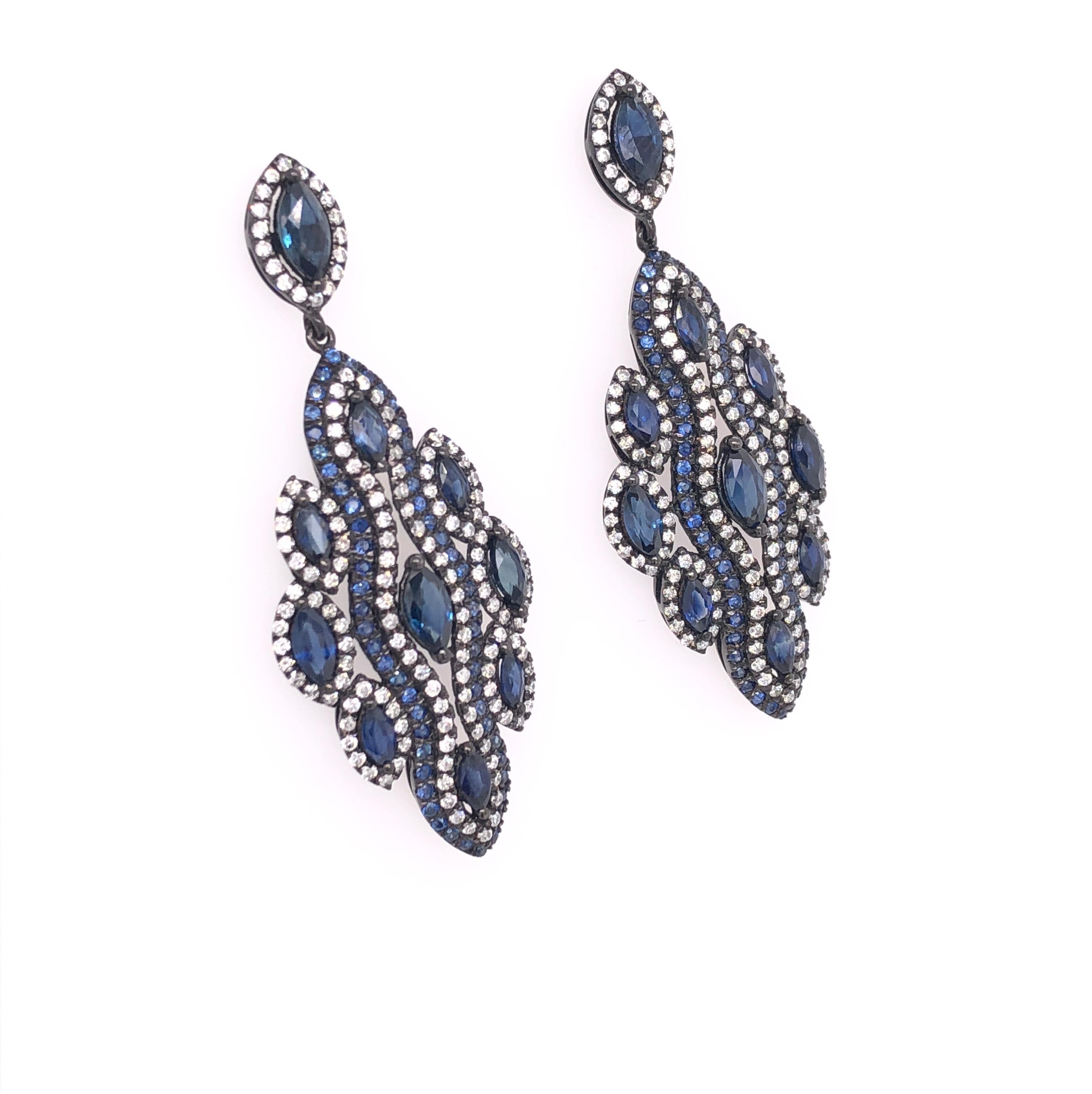Midnight Blue Collection

Drop blue Sapphire and Diamond earrings set in 18K black rhodium gold. 

Blue Sapphires: 7.38ct total weight.
Diamonds: 1.19ct total weight.
All diamonds are G-H/SI stones.
Width - is approximately 2cm/0.79inches.
Height -