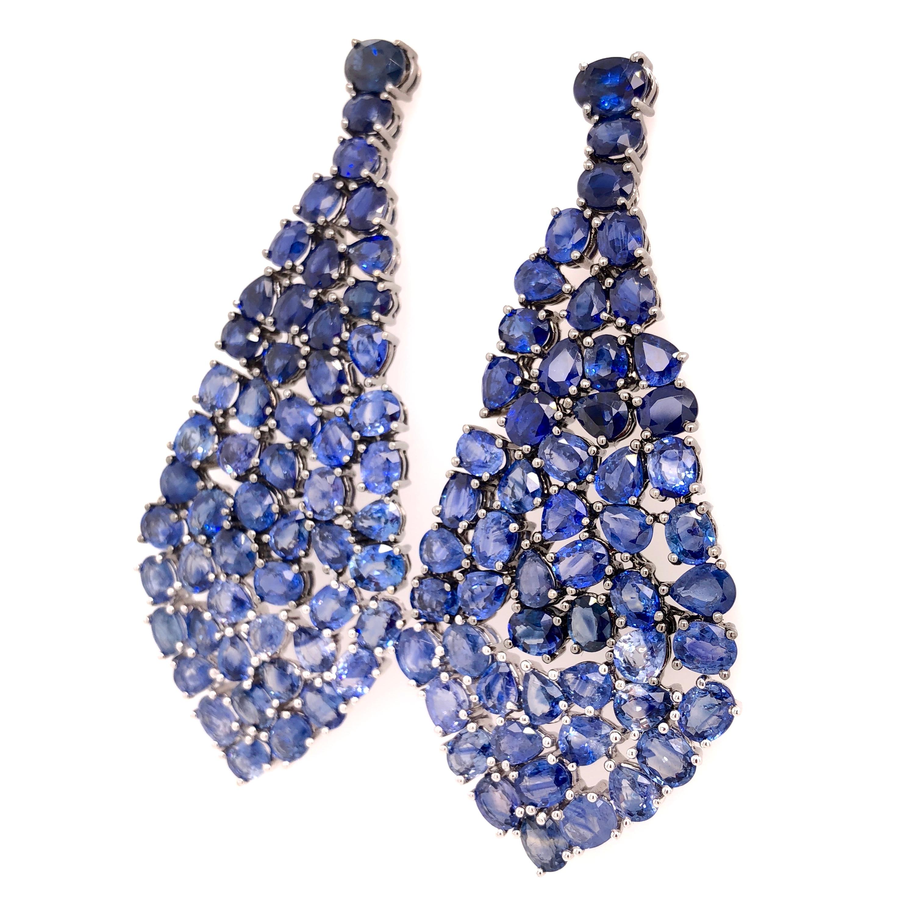 Midnight Blue Collection 

Blue Sapphire gradient drop dangle chandelier earrings set in 18K black and white gold.

Blue Sapphire: 49.29ct total weight.
Height - is approximately 7.2cm/2.84inches.
Width - is approximately 3.3cm/1.30inches.