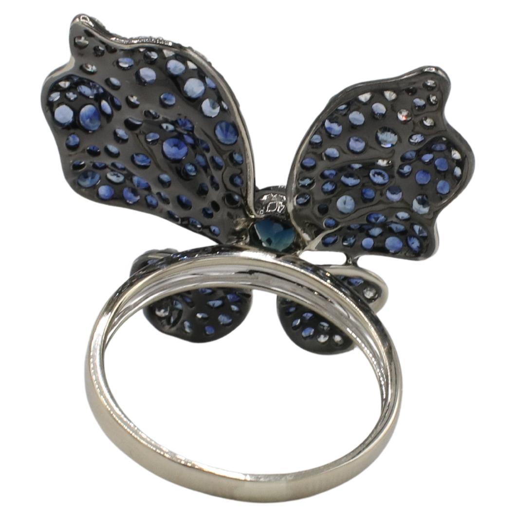 Ruchi New York Butterfly Natural Blue Sapphire & Diamond Cocktail Ring 
Metal: 18k white gold and black rhodium
Weight: 6.3 grams
Top: 29 x 27mm
Size: 8 (US)
Diamonds: Approx. 0.60 CTW F-G VS natural round diamonds
Sapphires: Center is approx. .40