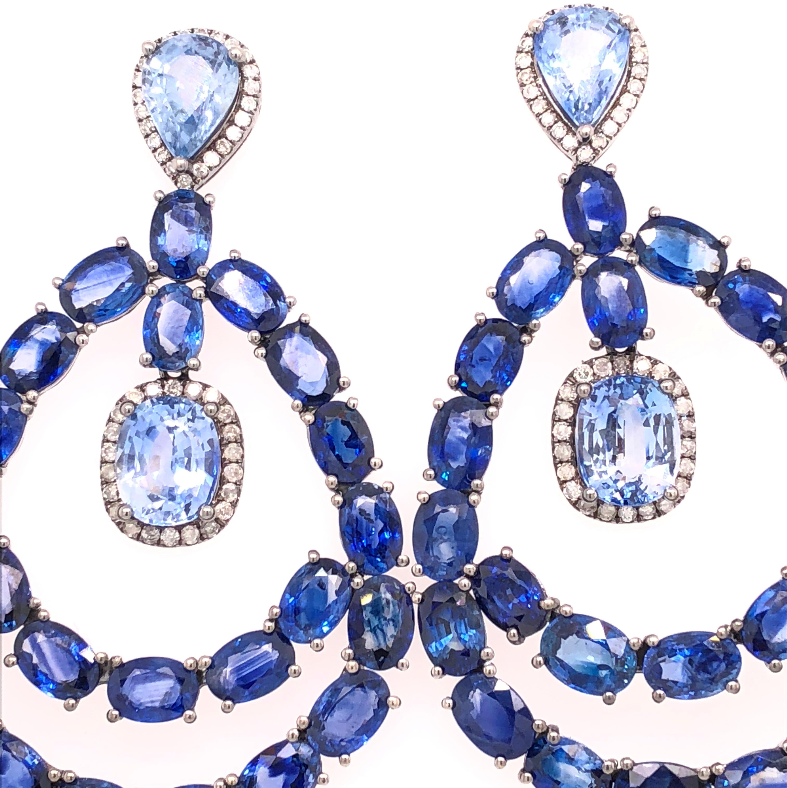 Midnight Blue Collection

Chandelier blue Sapphire and Diamond earrings set in 18K black rhodium gold. 

Blue Sapphires: 35.16ct total weight.
Diamonds: 0.61ct total weight.
All diamonds are G-H/SI stones.
Width  -  is approximately