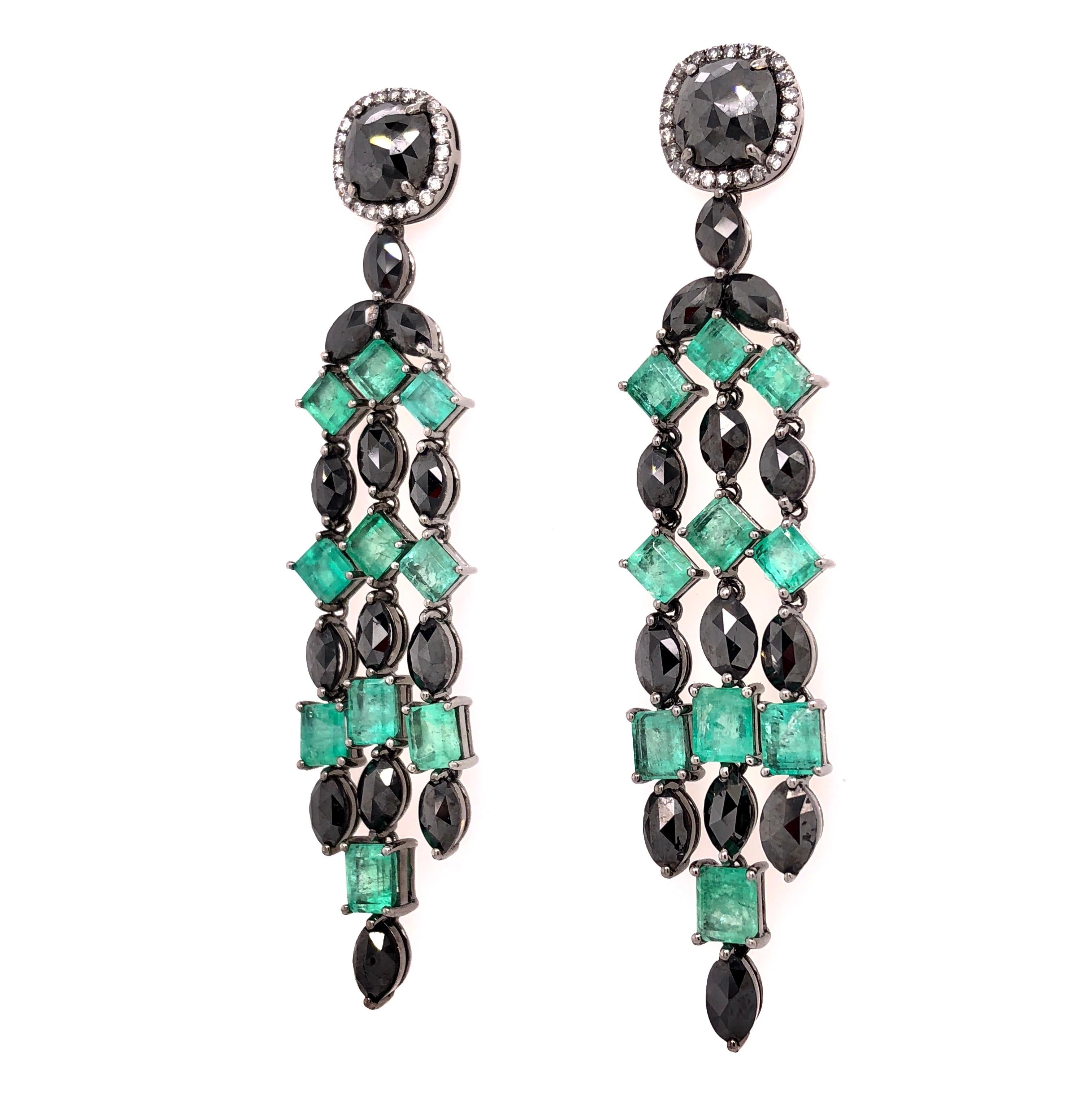 Green Lagoon Collection

Colombian Emerald and black Diamond chandelier earrings set in 18K black rhodium gold. 

Emerald: 5.89ct total weight.
Black Diamonds: 7.52ct total weight.
Diamond: 0.25ct total weight. 
All diamonds are G-H/SI