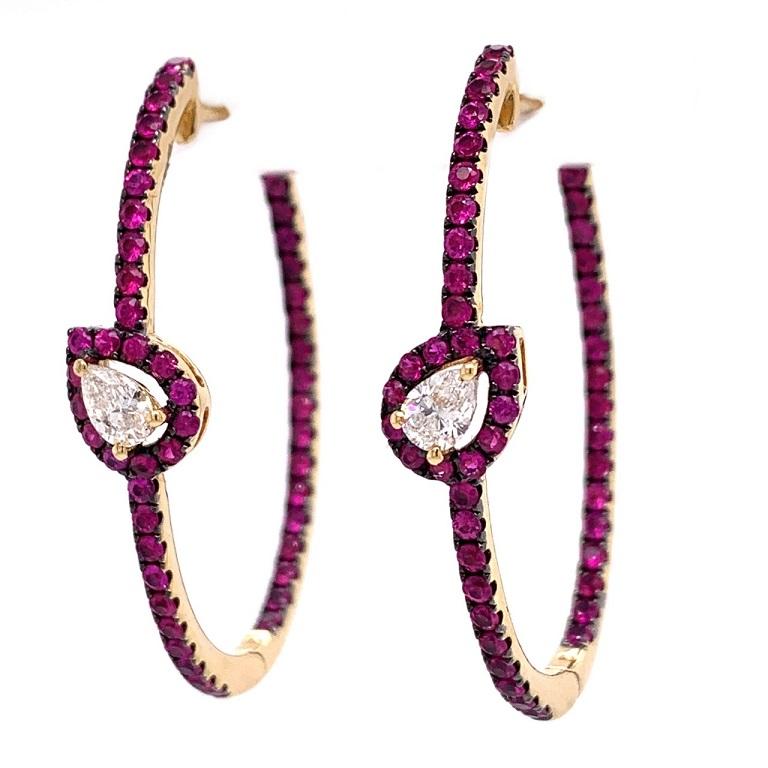 Crimson Collection

Pear Shape Diamond and Ruby hoop earrings set in 18K yellow gold.

Ruby: 1.62ct total weight.
Diamonds: 0.38ct total weight.
All Diamonds are G-H/SI stones.
