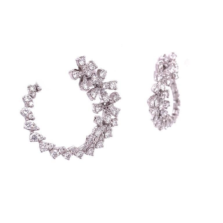 Scintillation Collection

Playful Diamond flower C-Shape earrings set in 18k white gold. 

Diamonds: 2.03ct total weight.
All diamonds are G-H/SI stones.
