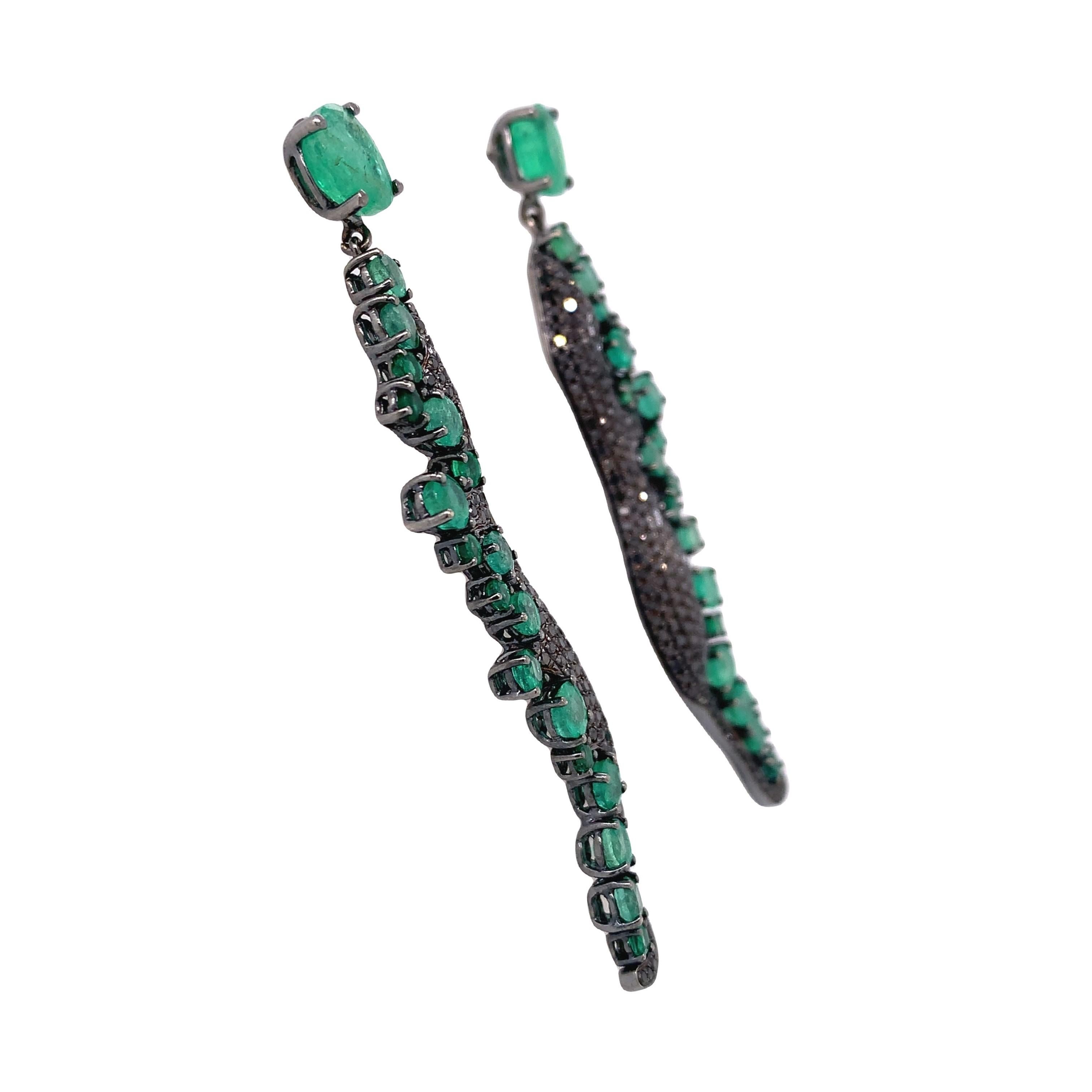 Green Lagoon Collection 

Drop chandelier Emerald with black Diamond pavé set in 18K black rhodium gold. 

Emerald: 5.66ct total weight.
Black Diamonds: 1.37ct total weight.
All diamonds are G-H/SI stones.
Height - is approximately