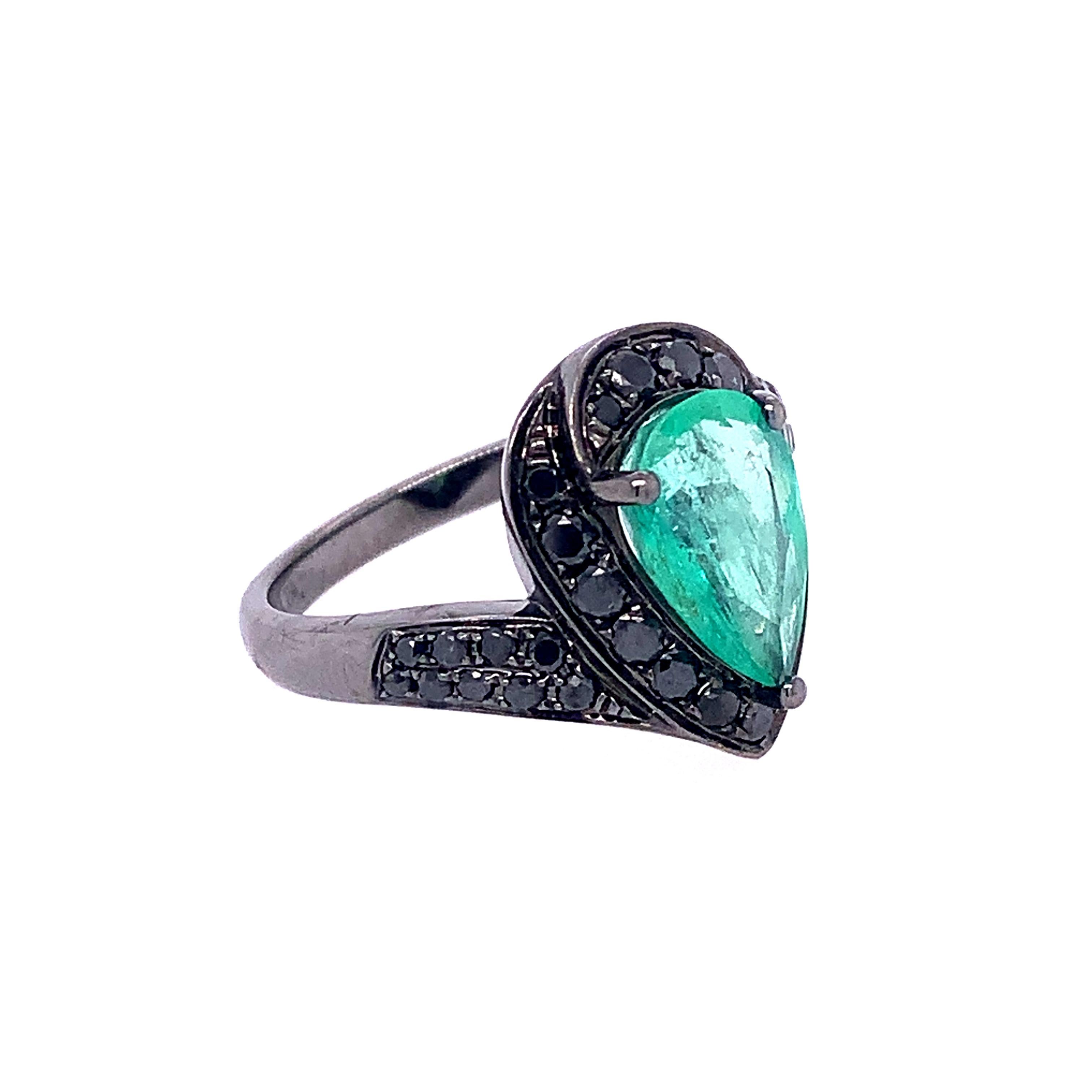 Lagoon Collection,

Pear shape Emerald center with black Diamonds accent set in 18k blackened gold. Ring size 7 U.S.

Emerald: 1.78ct total weight.
Black Diamond: 0.65ct total weight.

