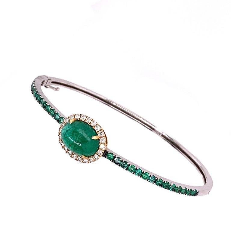 Green Lagoon Collection

Emerald cabochon with Diamond halo bangle bracelet set in 18 karat two tone gold. 

Emerald:  4.89ct total weight.
Diamonds: 0.31ct total weight.
All diamonds are G-H/SI stones.