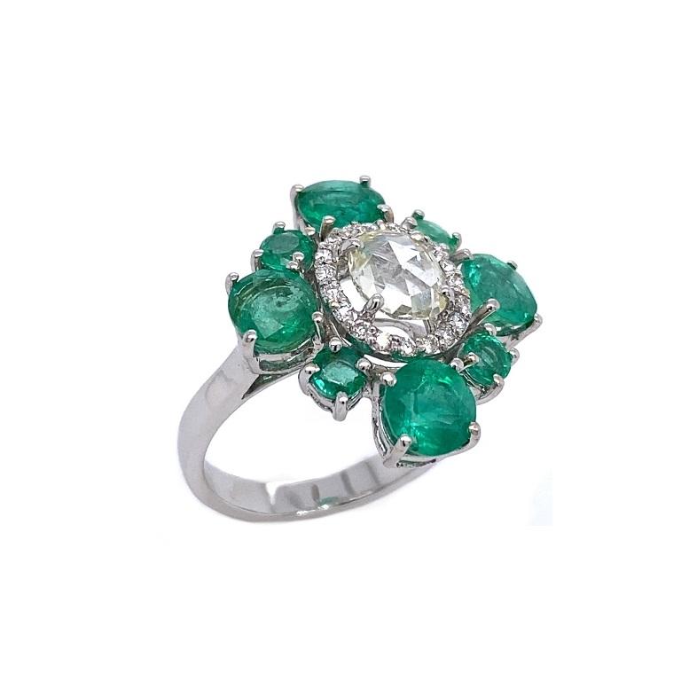 Set in 18K white gold. 
US size 5.25.
Emeralds: 3.30ct total weight.
Diamonds: 0.73ct total weight.
All diamonds are G-H/SI stones.