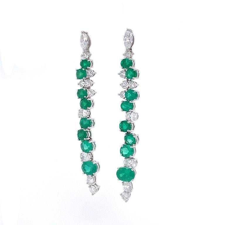 Jardin Collection 

Emerald and Diamond dangle earrings with a mix of oval, round and marquise shapes. Set in 18K white gold. 

Emeralds:6.62ct total weight.
Diamonds: 3.19ct total weight.
All diamonds are G-H/SI stones.