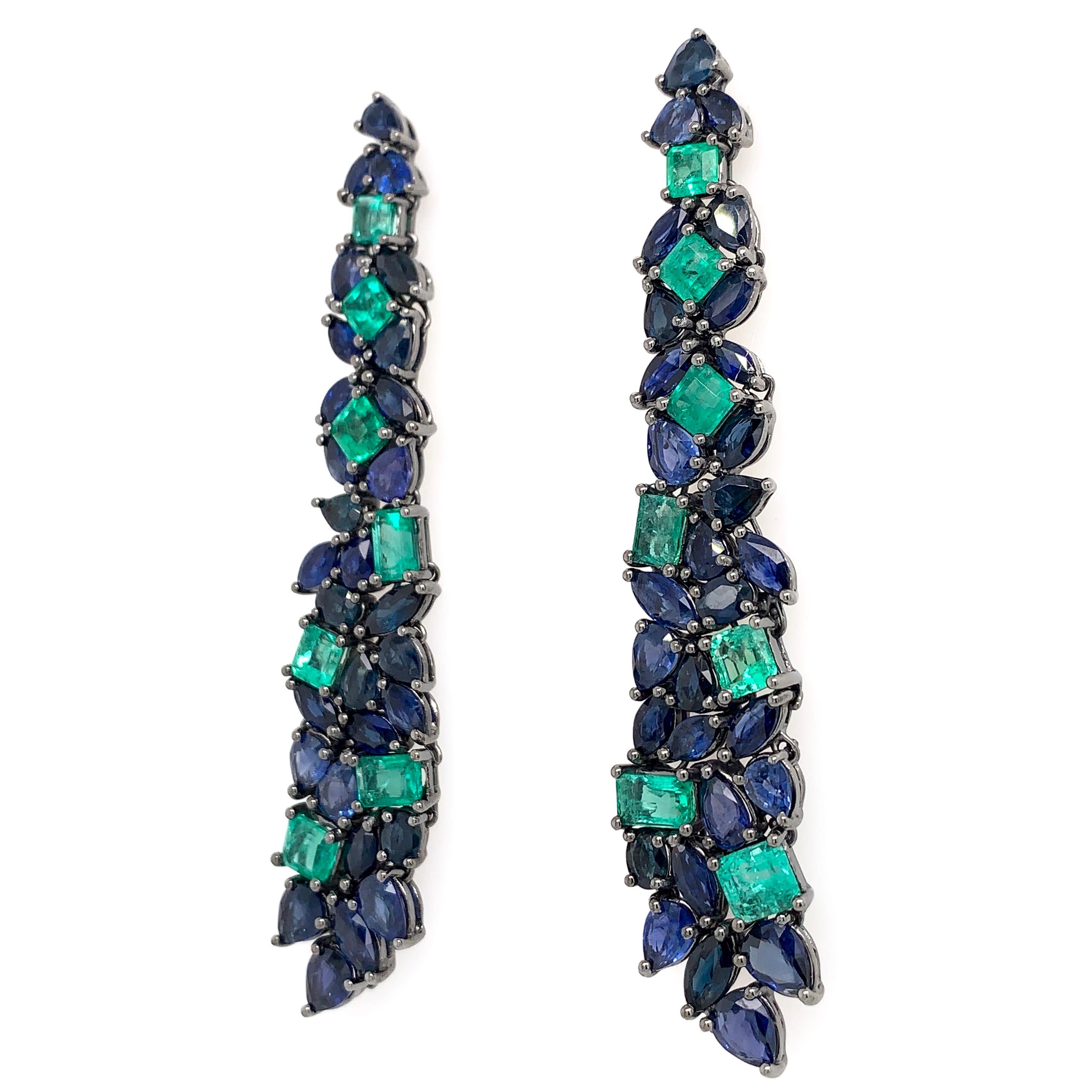 Earthly Hues Collection

Emerald and blue Sapphire chandelier earrings set in 18K black rhodium gold.

Sapphire: 11.04ct total weight.
Emerald: 4.26ct total weight.