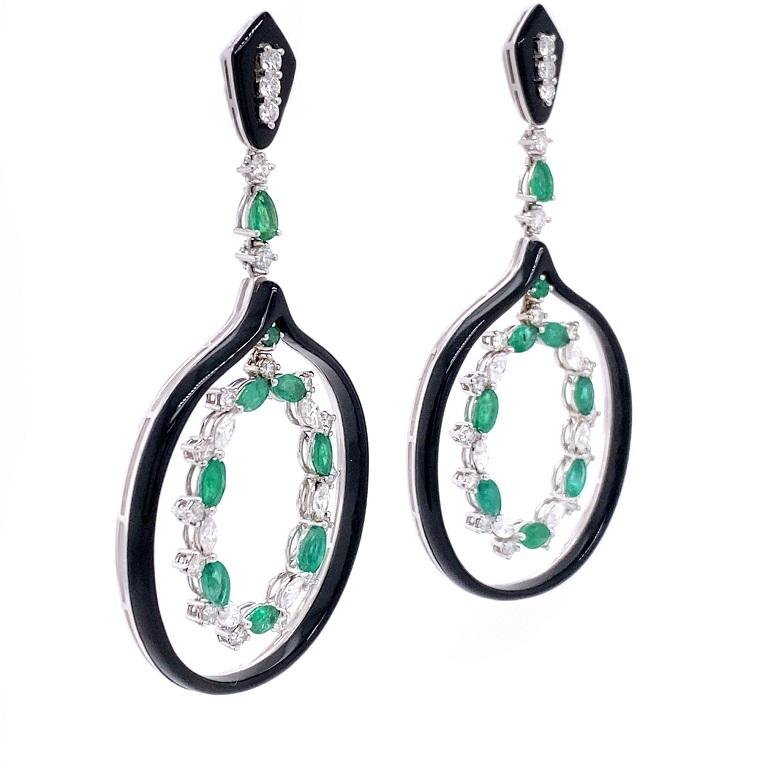 Set in 18K white gold. 
Emeralds: 3.29ct total weight.
Diamonds:2.70ct total weight.
All diamonds are G-H/SI stones.