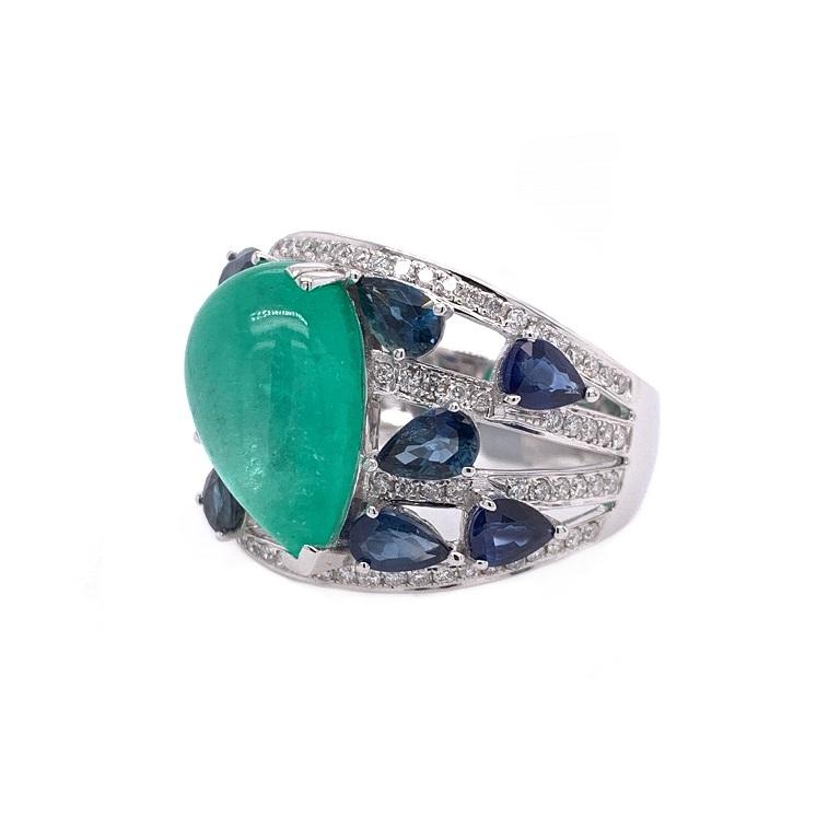 18K white gold. 
US size 6.5.
Emerald: 5.31ct total weight.
Blue Sapphires: 2.86ct total weight.
Diamonds: 0.46ct total weight. 
All diamonds are G-H/SI stones.