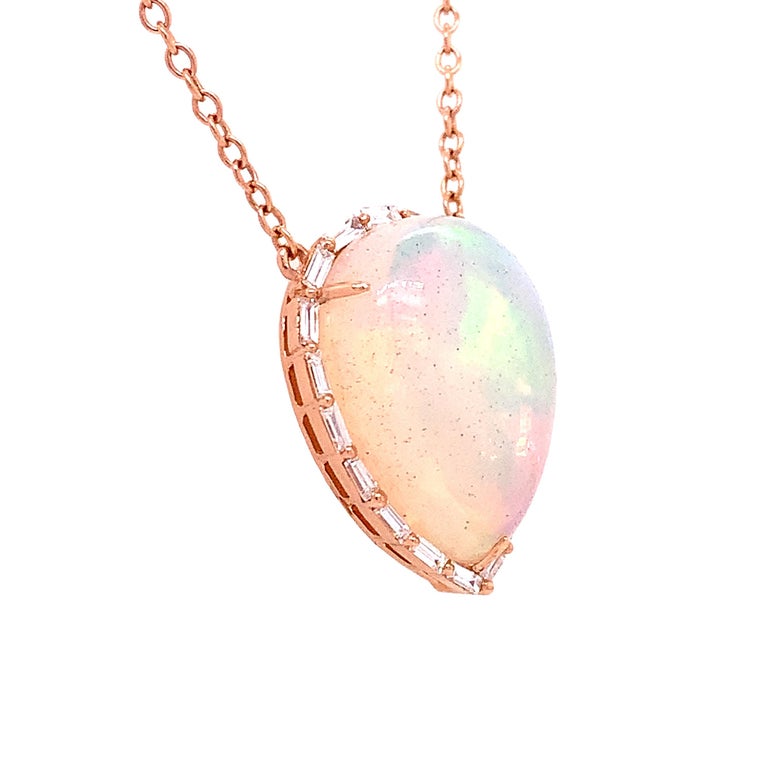 Iridescence Collection

An Opal that captivates the eye with its gorgeous color play. Glimmering Baguette Diamonds surround the gemstone to form a beautiful 18k Rose Gold pendant with 16 to 18 inches adjusting chain.

Opal: 7.61ct total