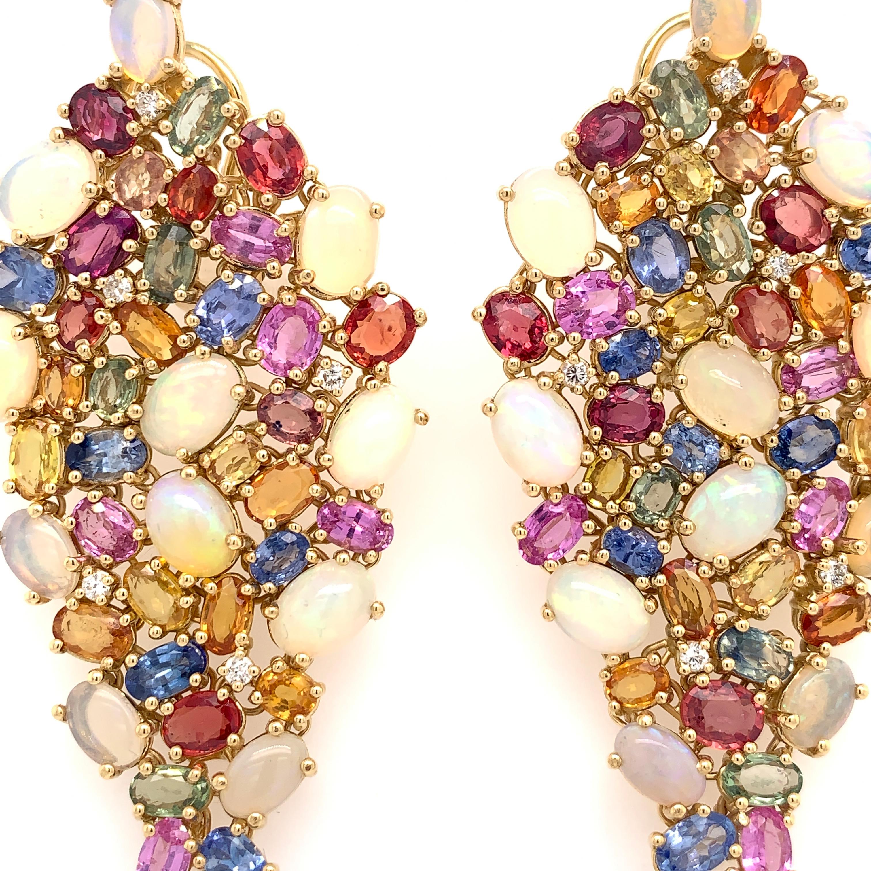 Play of Colors Collection 

Ethiopian Opal, Color Sapphire and Diamond chandelier earrings set in 18K yellow gold. 

Color Sapphire: 19.32ct total weight.
Ethiopian Opal: 9.81ct total weight.
Diamonds: 0.21ct total weight.
All diamonds are G-H/SI