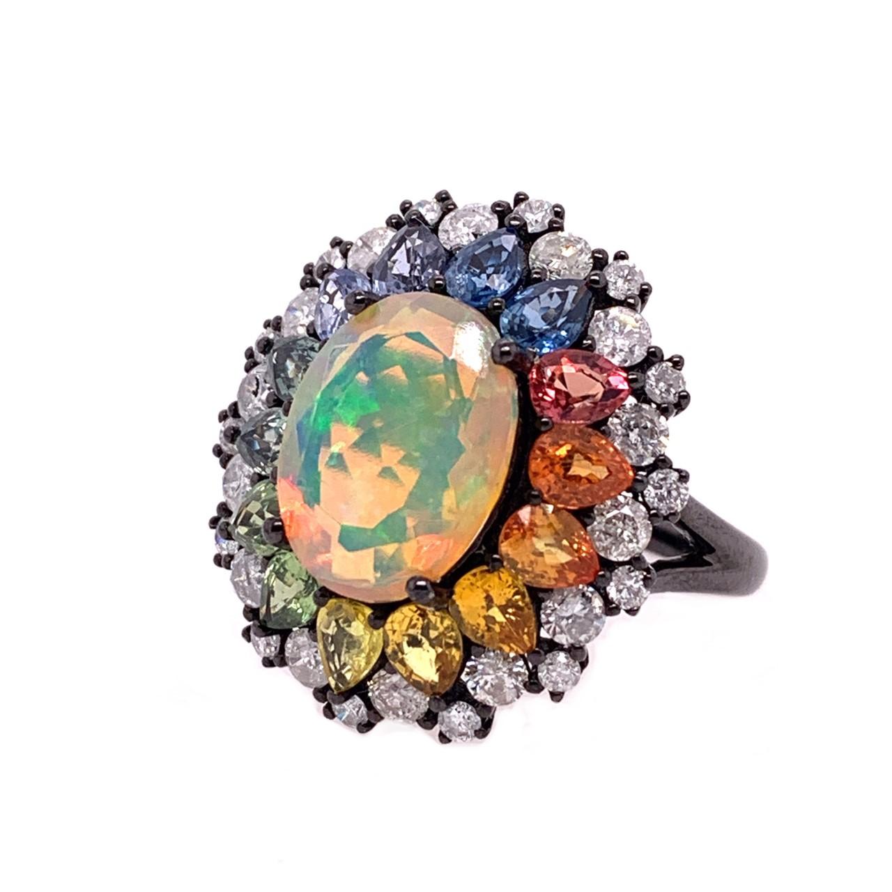 Play of Colors Collection

Faceted Ethiopian Opal bursting with color, surrounded by a rainbow of Sapphires and white Diamonds set in 18 karat black rhodium gold.  

Ethiopian Opal: 2.59ct total weight.
Multi Colored Sapphires: 2.85ct total