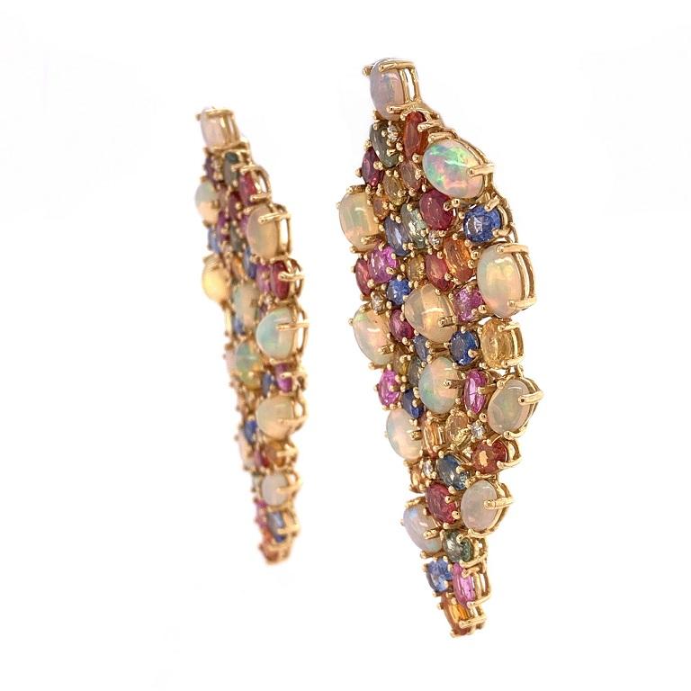 Iridescence Collection 

Colorful Ethiopian Opal, multi colored Sapphires and Diamonds make up a mosaic masterpiece in these chandelier earrings. Set in 18K yellow gold. 

Ethiopian Opal: 9.81ct total weight.
Multi Colored Sapphires: 19.32ct total