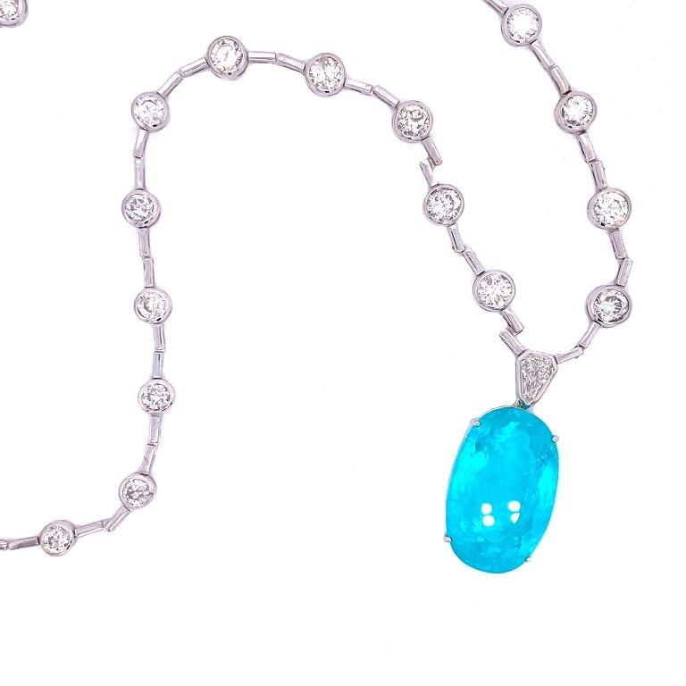 Exclusive Collection 

Impressively large and bright Paraiba Tourmaline and Diamond statement necklace set in 18K white gold. Pendant is removable for ultimate versatility. Diamond chain 20 inches, and the Paraiba Tourmaline is 1 inch long and just