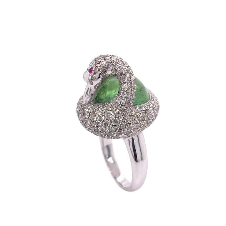 White Diamond swan with Ruby eyes and green Tourmaline. 18K White Gold.

US size 7
Green Tourmaline: 13.78ct total weight. 
Ruby: 0.06ct total weight. 
Diamonds: 3.17ct total weight. 
All diamonds are G-H/SI stones.