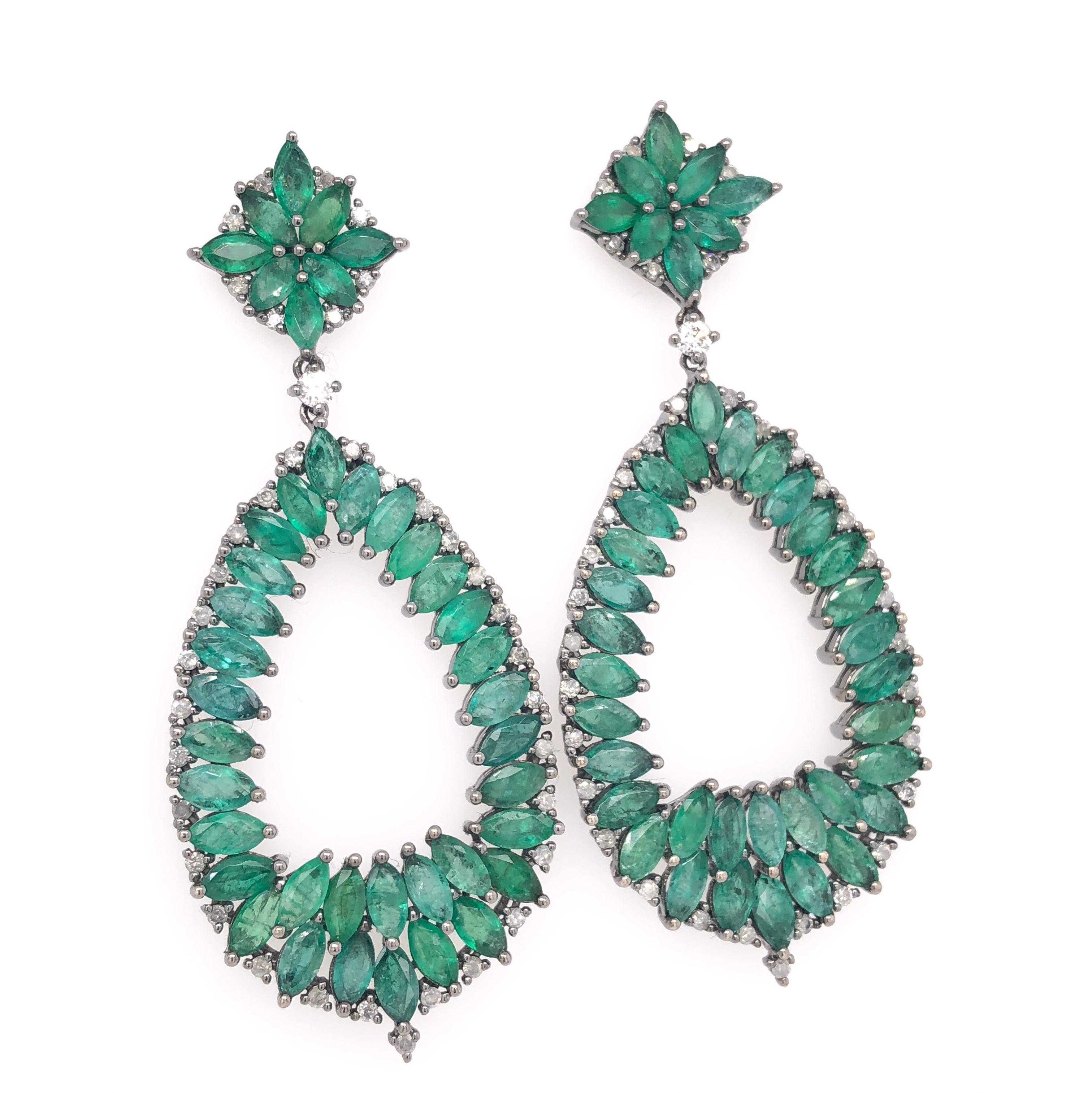 Green Lagoon Collection

Marquise shaped Emerald and round Diamond chandelier earrings set in 18K black rhodium gold. 

Emerald: 13.39ct total weight.
Diamonds: 0.88ct total weight.
All diamonds are G-H/SI stones.
Height - is approximately