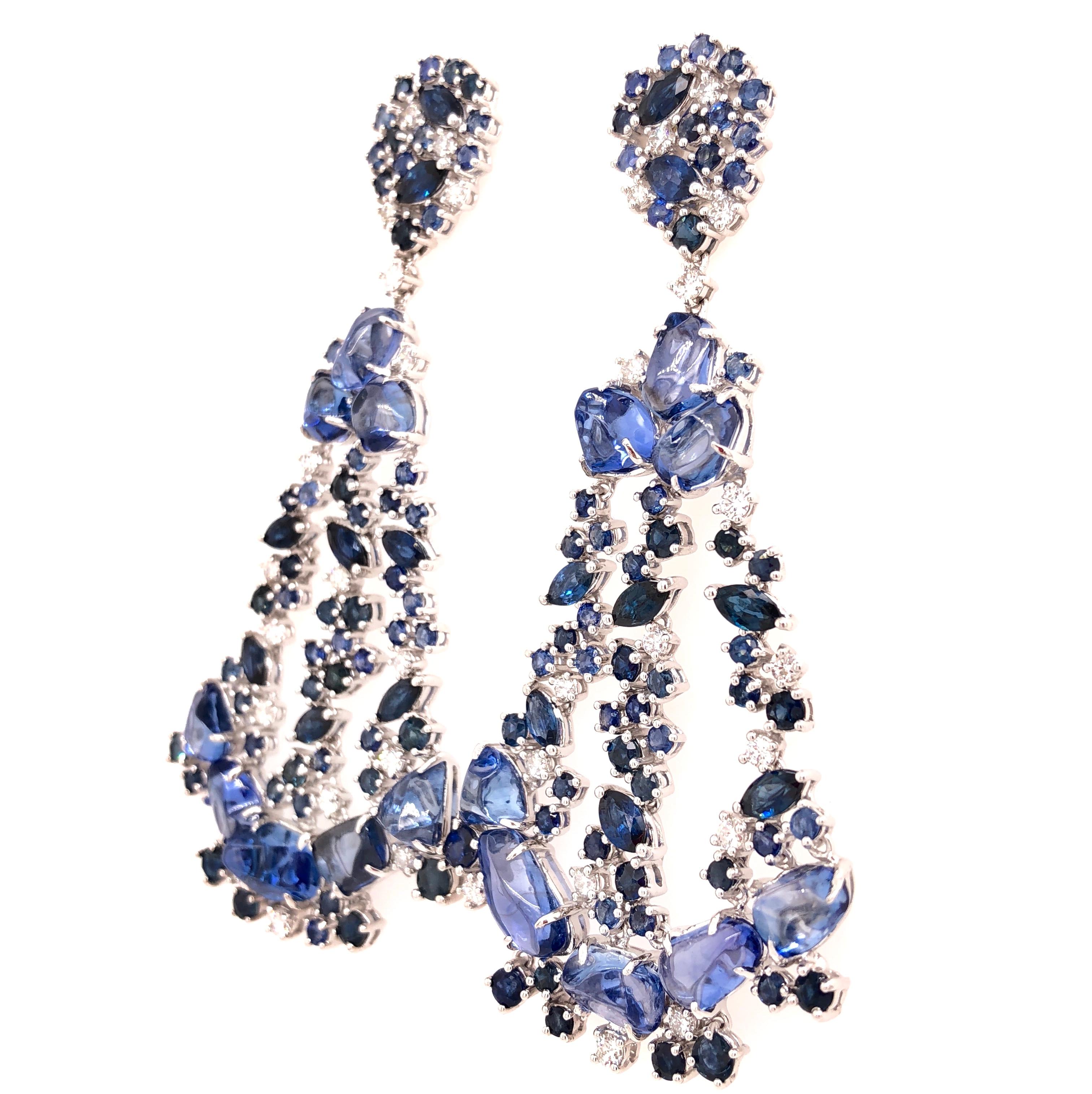 Aurora Collection 

Multi shape blue Sapphire and Diamond chandelier earrings set in 18K white gold.

Blue Sapphire: 35.91ct total weight.
Diamonds: 1.34ct total weight.
All diamonds are G-H/SI stones.
Height - is approximately 7.5cm/3inches.
Width