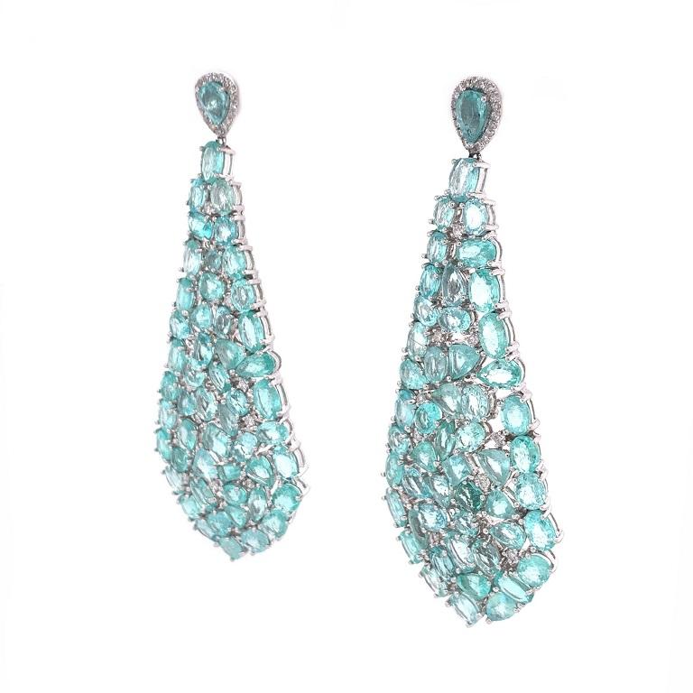 Exclusive Collection

Dreamy multi shape Paraiba Tourmaline and Diamond chandelier earrings set in 18K white gold. 

Paraiba Tourmaline: 32.86ct total weight. 
Diamonds: 0.62ct total weight.
All diamonds are G-H/SI stones.