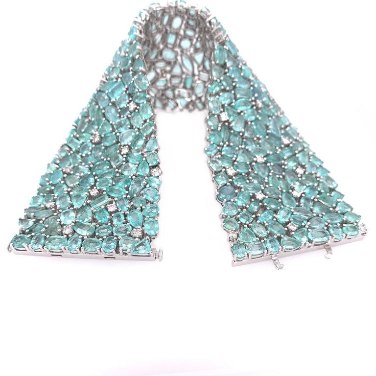 Exclusive Collection

Make a bold statement with this bright multi shape Paraiba Tourmaline and Diamond bracelet with hidden bar clasp, set in 18K white gold. 

Paraiba Tourmaline: 85.09ct total weight. 
Diamonds: 2.00ct total weight. 
All diamonds