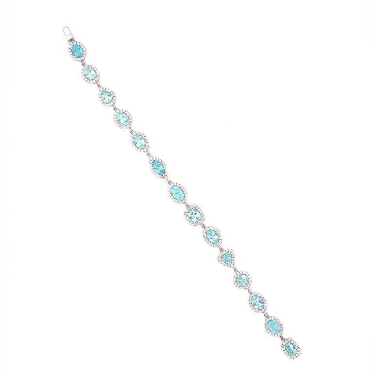 Exclusive Collection

A bright twist on a classic style. Multi shape Paraiba Tourmaline and Diamond tennis bracelet set in 18K white gold. 

Paraiba Tourmaline: 8.67ct total weight. 
Diamonds: 2.04ct total weight.
All diamonds are G-H/SI stones.