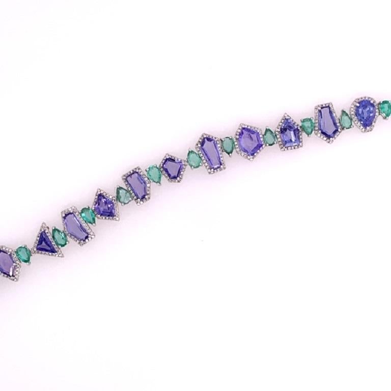 Green Lagoon Collection

Unique multi shape Tanzanite, Emerald and Diamond bracelet set in 18 karat white gold. 

Tanzanite: 11.09ct total weight.
Emerald: 3.10ct total weight.
Diamonds: 0.90ct total weight. 
All diamonds are G-H/SI stones.