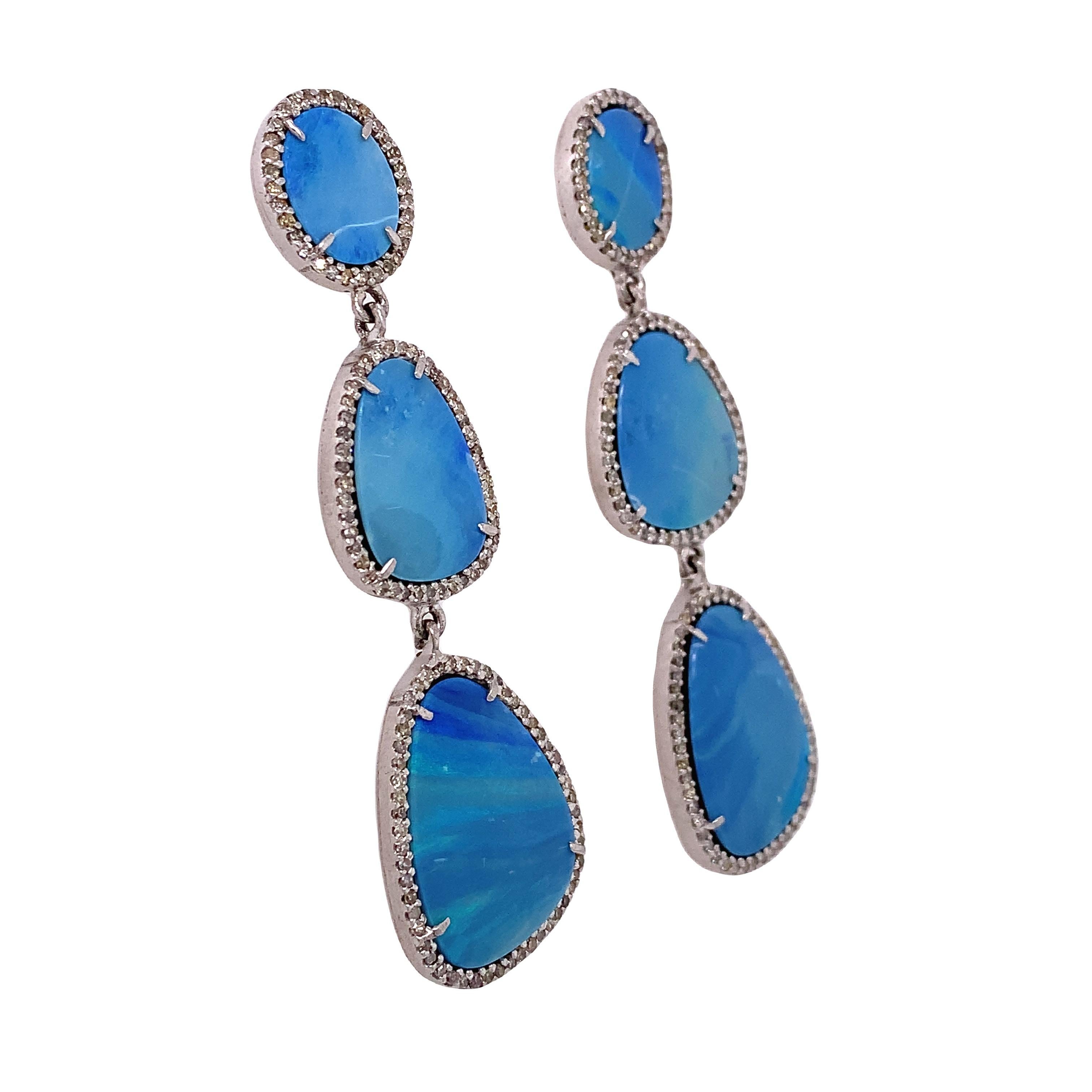 Life in color collection

Australian Slice Opal accented by icy diamonds features triple dangling earrings set in Silver plate.

Opal: 32.50ct total weight
Diamond: 1.68ct total weight 