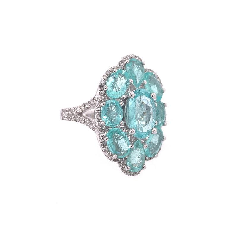 Exclusive Collection 

Elegant and eye catching cocktail ring featuring oval and pear shape Paraiba Tourmaline with Diamond halo and split shank. Set in 18K white gold. US size 6, can be resized. 

Paraiba Tourmaline: 4.28ct total weight. 
Diamonds: