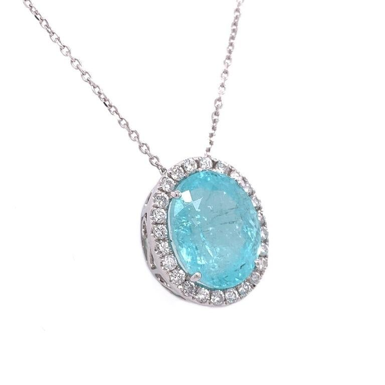 Exclusive Collection

Brilliant color and impressive size. Paraiba Tourmaline pendant with Diamond halo set in 18K white gold on 16 inch chain. 

Paraiba Tourmaline: 7.65ct total weight. 
Diamonds: 0.45ct total weight.
All diamonds are G-H/SI stones.