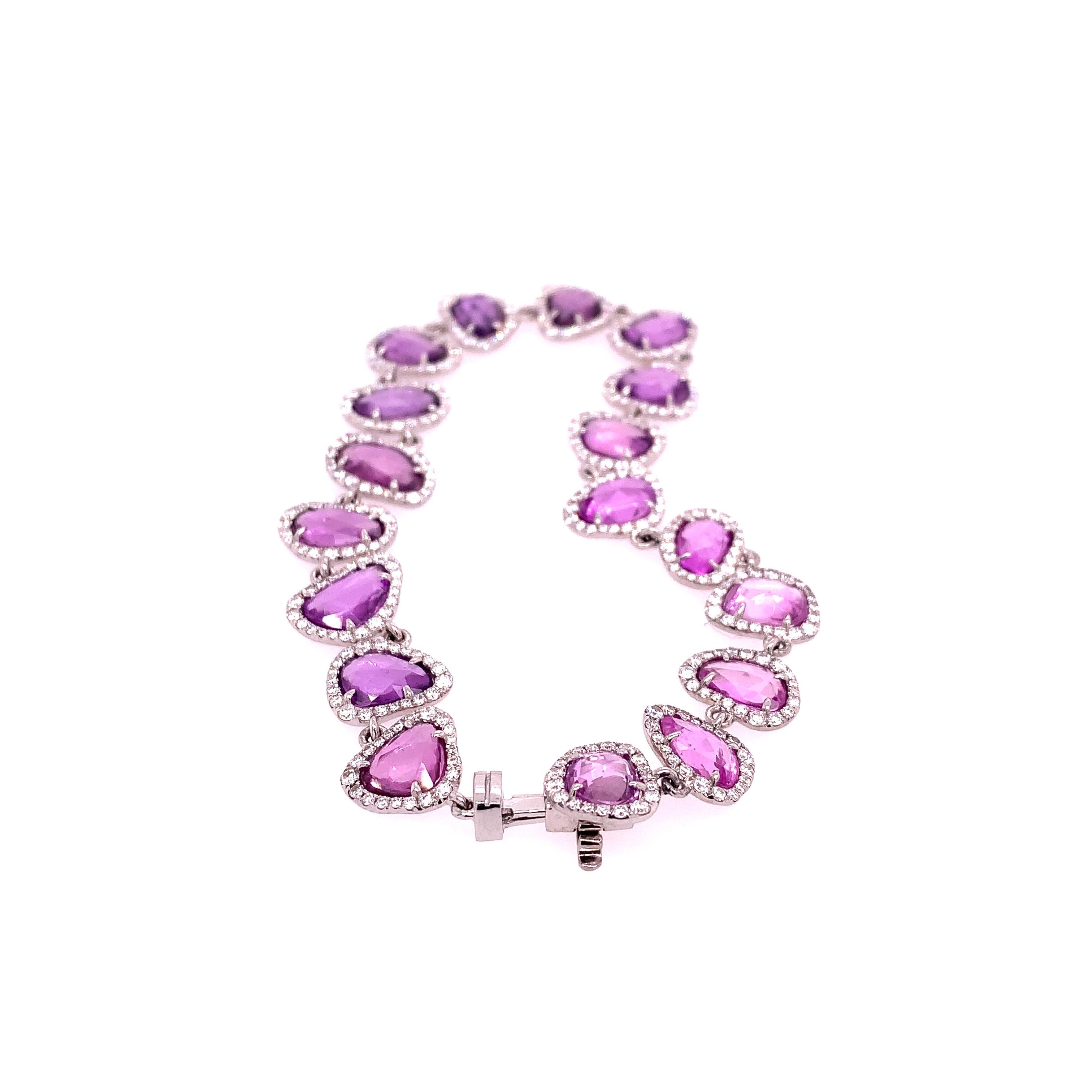 18K White Gold
Pink Sapphire: 13.92ct total weight
Diamond: 1.91ct total weight
All diamonds are G-H/SI stones.
