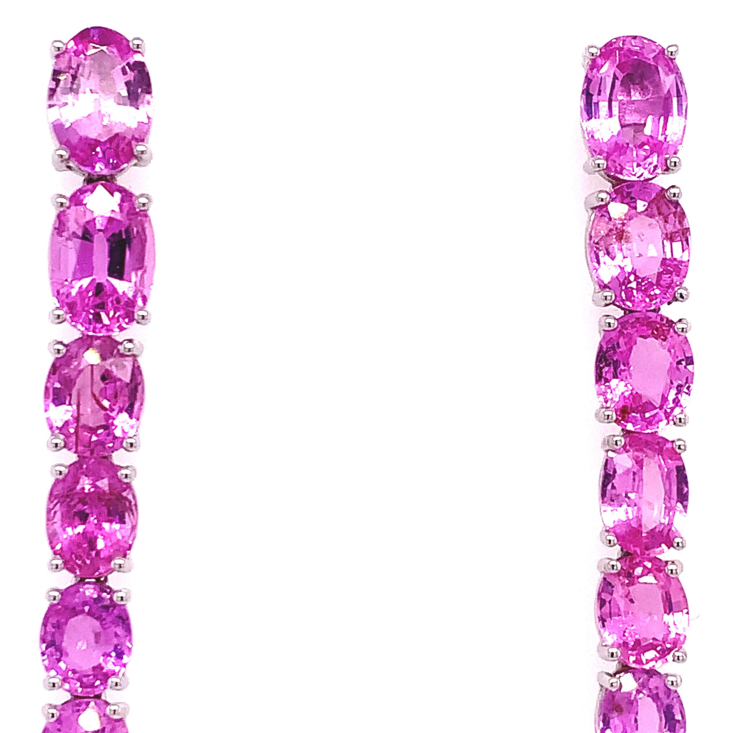 Pink Rose Collection 

These magnificent 18K White Gold linear earrings combine the vibrance of oval Pink Sapphires totaling 11.53 carats with the gentle sparkle of Diamonds