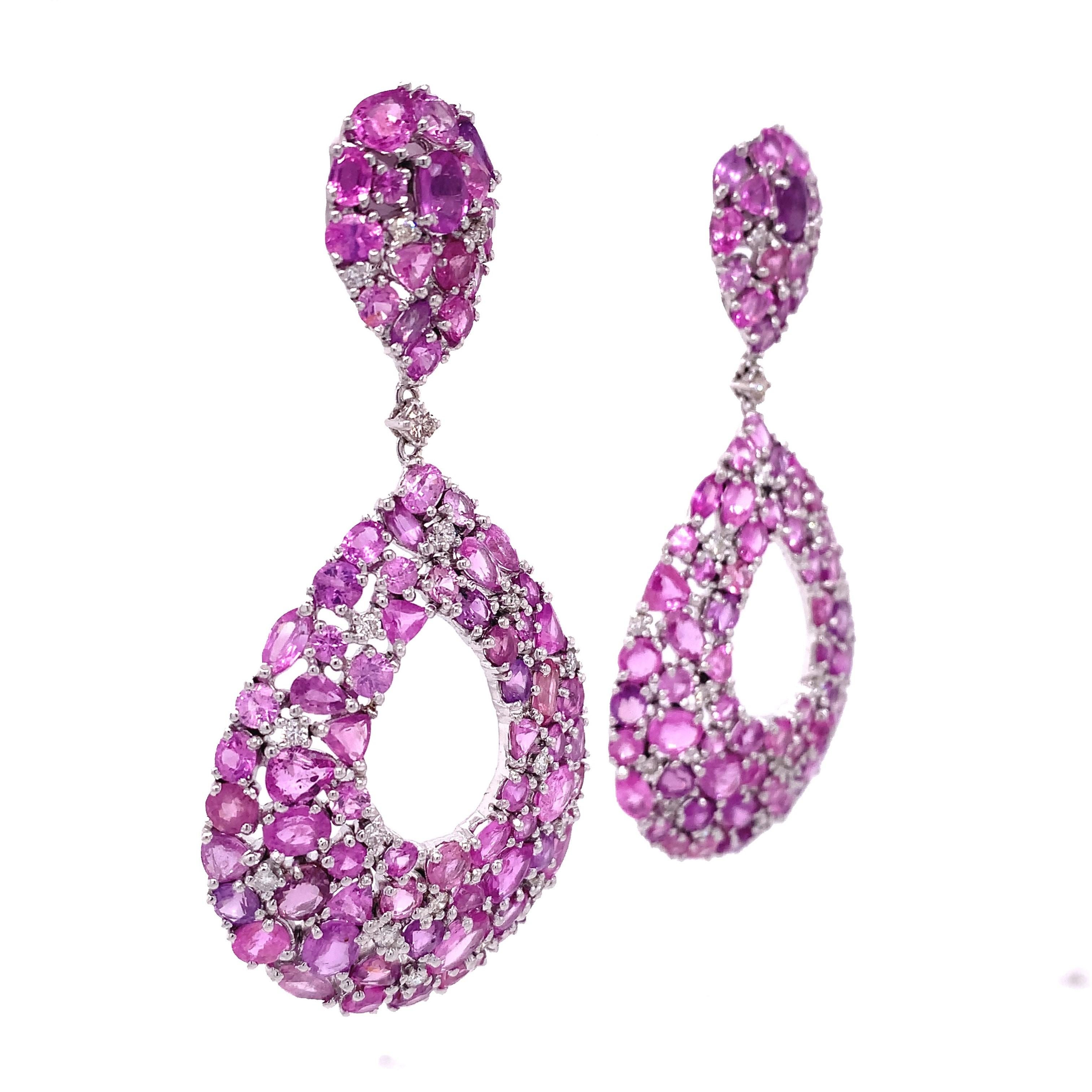 Pink Rose Collection

Combination of several shapes Pink Sapphire with white diamonds featuring dangle drop earrings set in 18K white gold.

Pink Sapphire: 33.09ct total weight.
Diamond: 0.91ct total weight.
All diamonds are G-H/SI stones.

